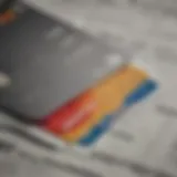 A close-up of a credit card with financial documents in the background