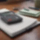 A calculator and a notebook on a desk, symbolizing budgeting for debt repayment.