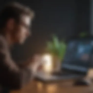 A focused individual analyzing a budget plan on a laptop